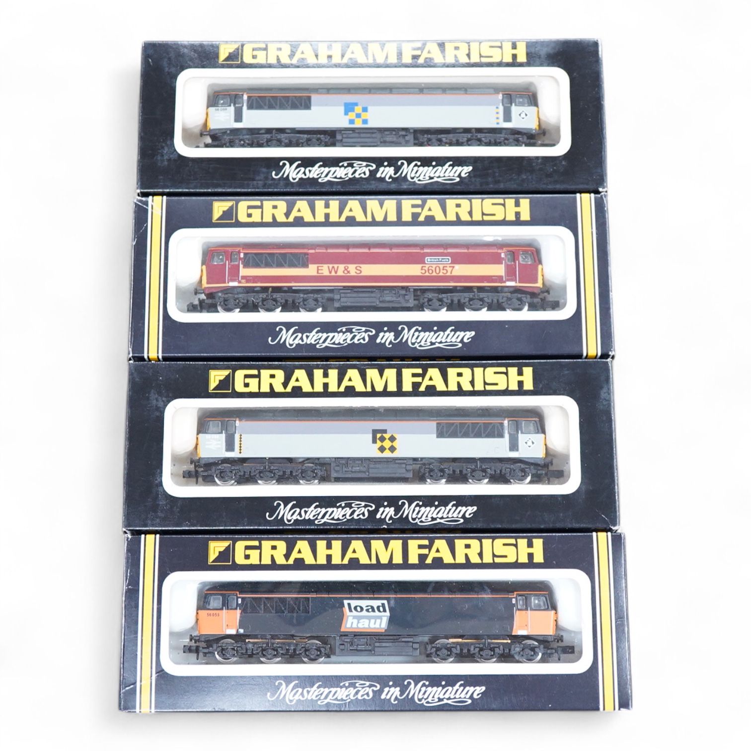 Four boxed Graham Farish N gauge railway class 56 diesel locomotives; a Load Haul, 56055, (805D), an EWS, British Fuels 56057 (805E), a Coal Sector, 56 092, (8057) and a Construction Sector, 56 059 (8056).